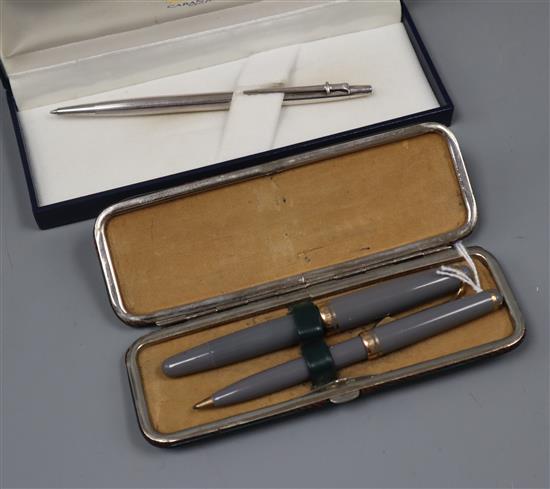 A Mont Blanc 252 grey finish fountain pen and propelling pencil set, cased and a Caran DAche silver ballpoint pen